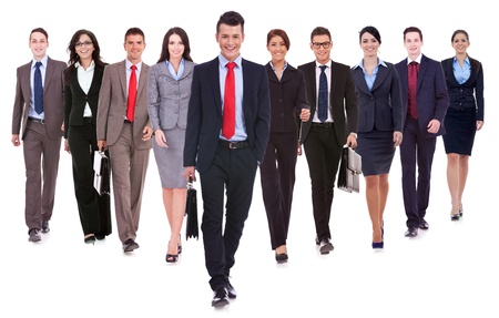 15175353 - successful happy business team walking towards the camera on white background